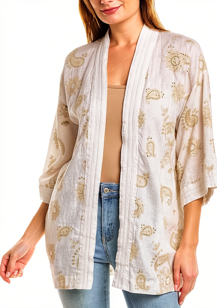 Johnny Was linen kimono draped on a chair showcasing embroidered details
